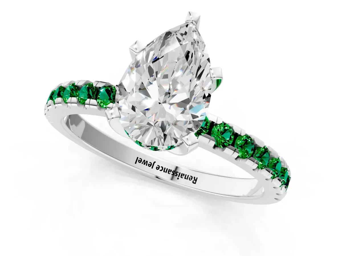Pear Cut Diamond Solitaire Ring with Round Emerald Pavé Band and Four-Prong Setting Silver