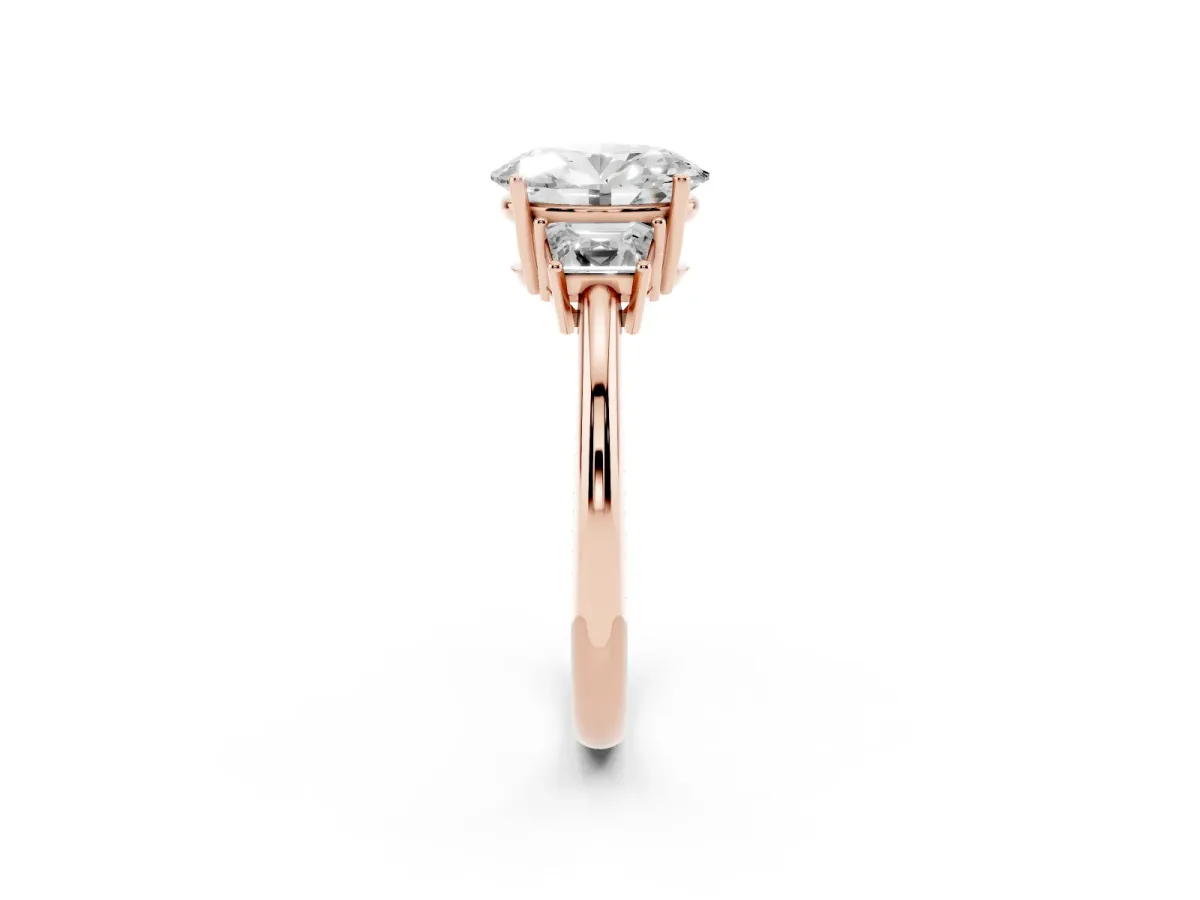 Oval Cut Diamond Three-Stone Ring with Trapezoid Side Stones and Prong Setting Rose gold