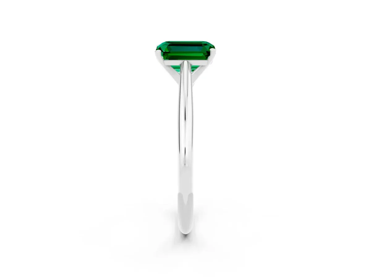 Emerald Cut Emerald Solitaire Engagement Ring with Cathedral Setting and Four-Prong Mount White gold