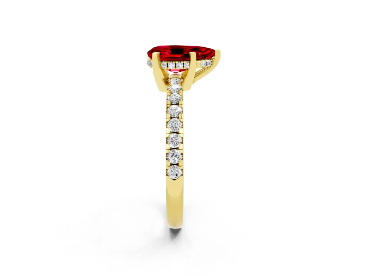 Pear Cut Ruby Solitaire Ring with Round Pavé Band and Four-Prong Setting Yellow gold