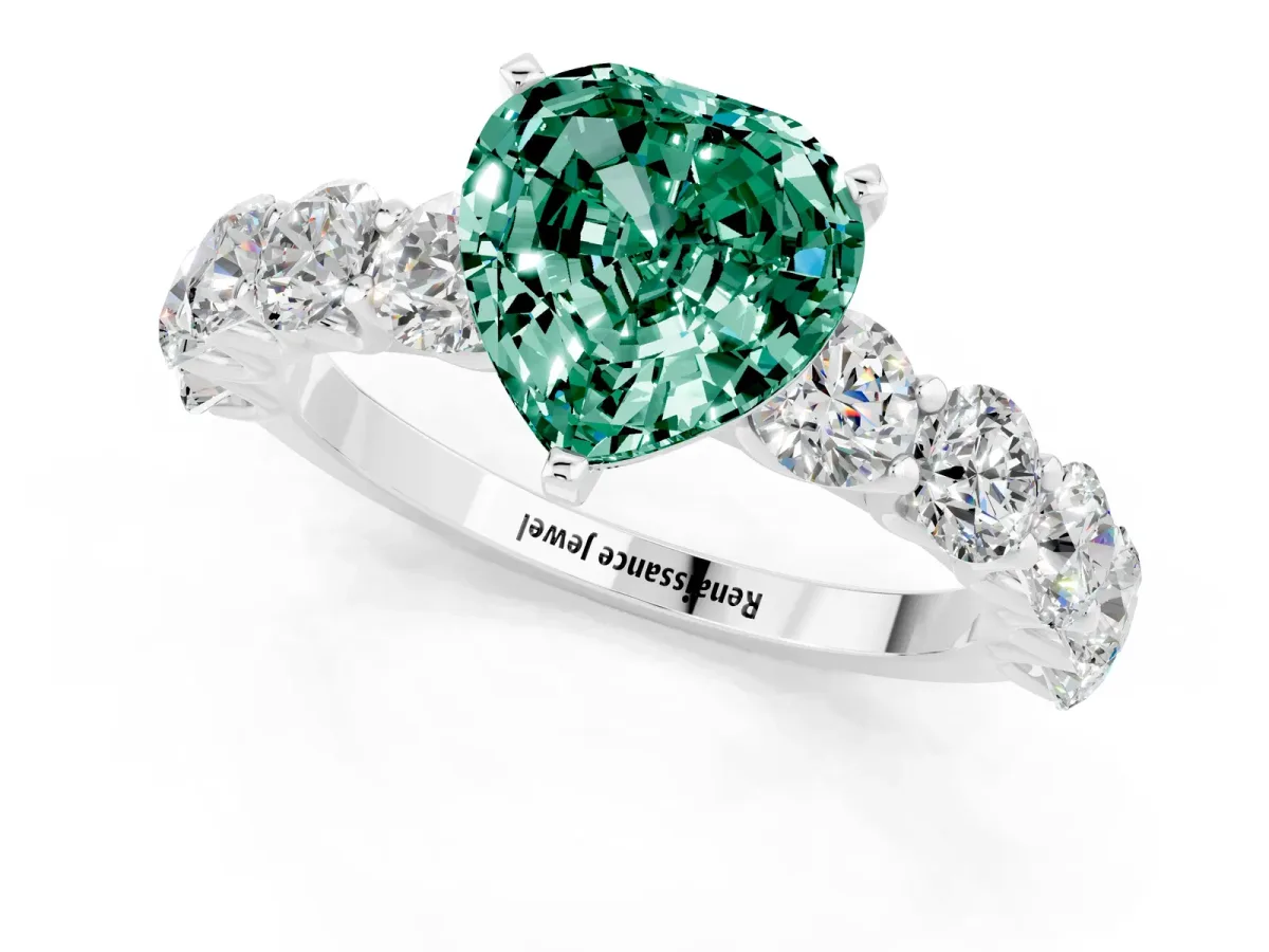 Heart Cut Green Sapphire Prong Setting with Side Stones on a Pave Band Silver