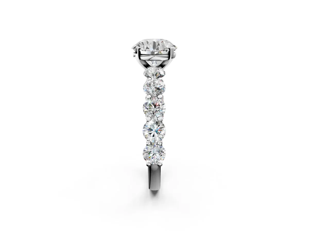 Round Cut Diamond Prong Setting with Side Stones on a Pave Band Platinum