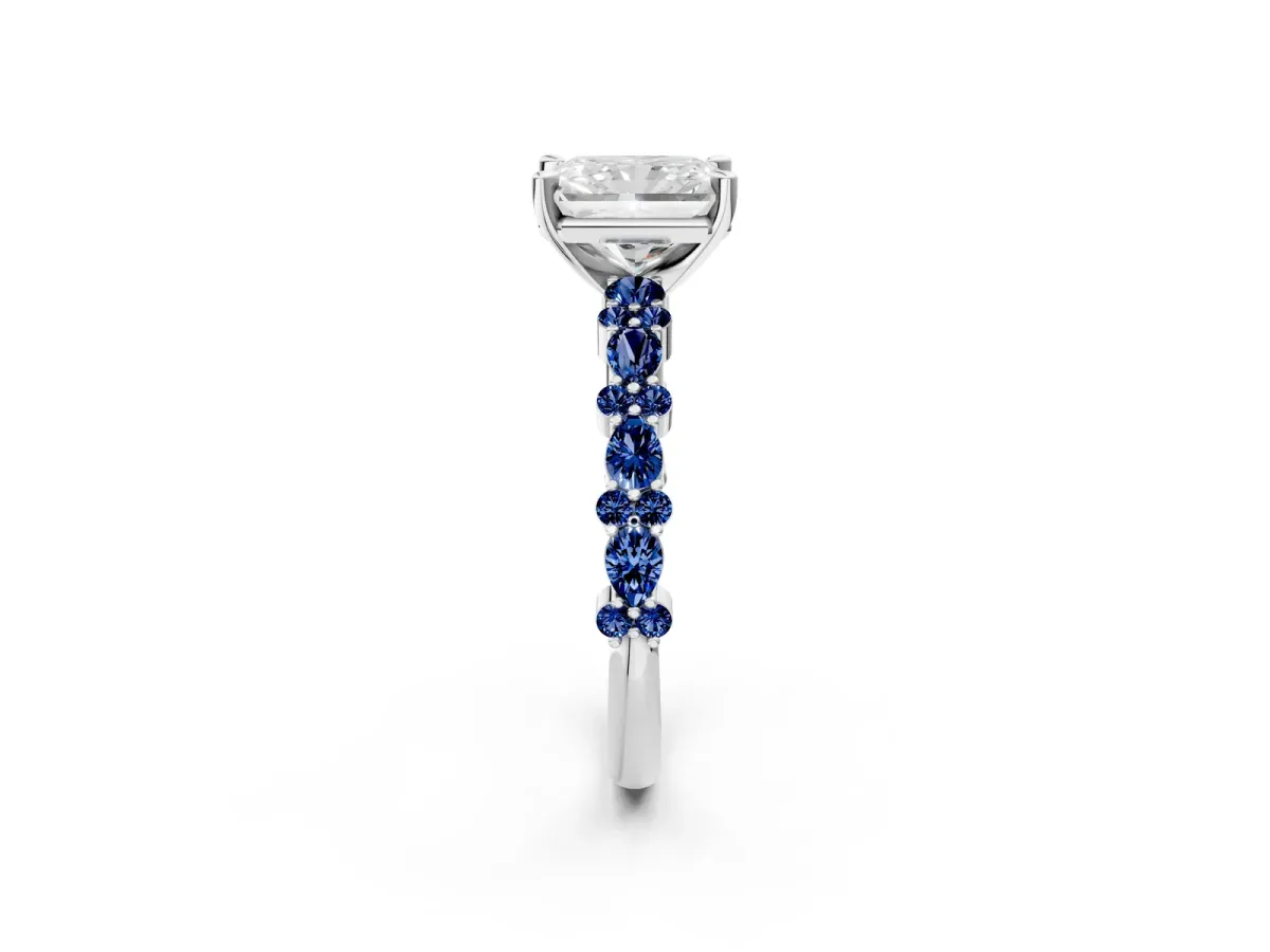 Radiant Cut Diamond Side Stone Solitaire Ring with Round Blue Sapphire and Four-Prong Setting Platinum
