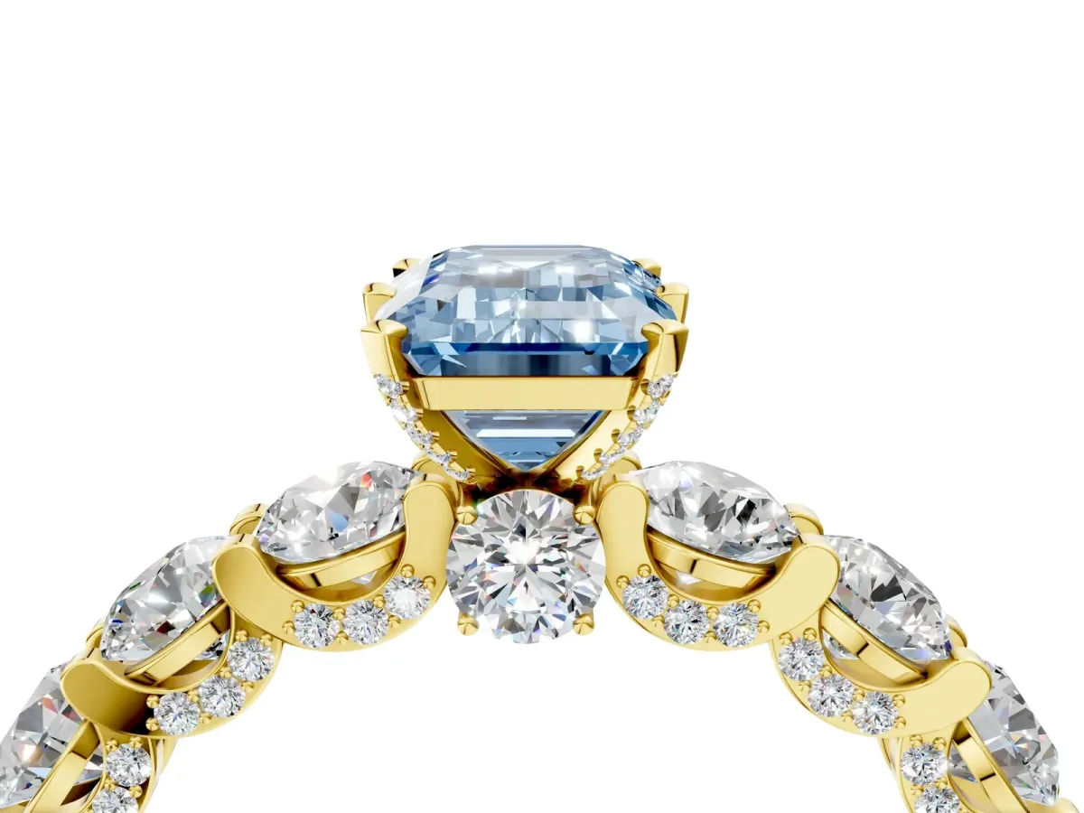 Fancy Blue Emerald Cut Diamond Side Stone Engagement Ring with Four-Prong Setting Yellow gold