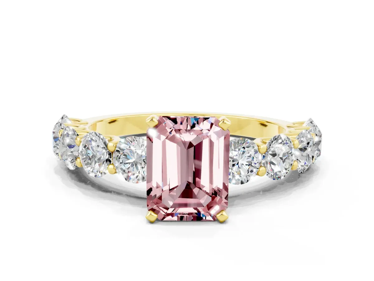 Emerald Cut Morganite Prong Setting with Side Stones on a Pave Band Yellow gold