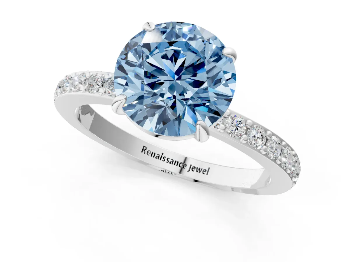 Fancy Blue Round Cut Diamond Solitaire Engagement Ring with Pavé Band and Four-Prong Setting Silver