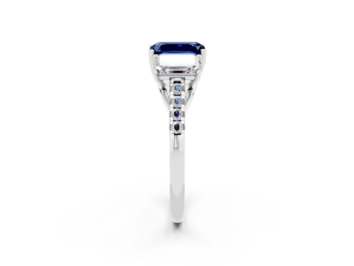 Three-Stone Emerald Cut Blue Sapphire Ring with Round Pavé Band and Prong Setting Platinum