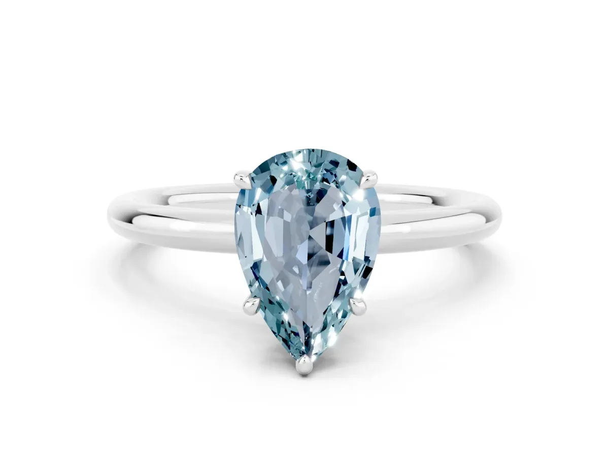 Pear Cut Aquamarine Solitaire Ring with Thin Band and Four-Prong Setting Silver
