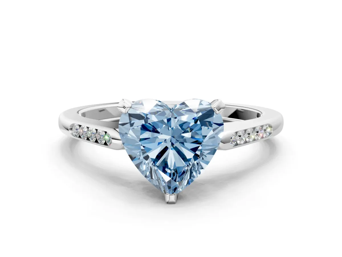 Fancy Blue Heart Cut Diamond Solitaire Ring with Channel Set Round Band and Prong Setting Silver