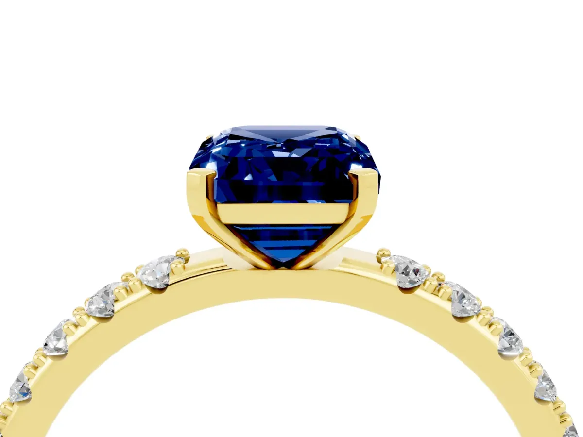Emerald Cut Blue Sapphire Solitaire Pavé Band with Four-Prong Setting Yellow gold