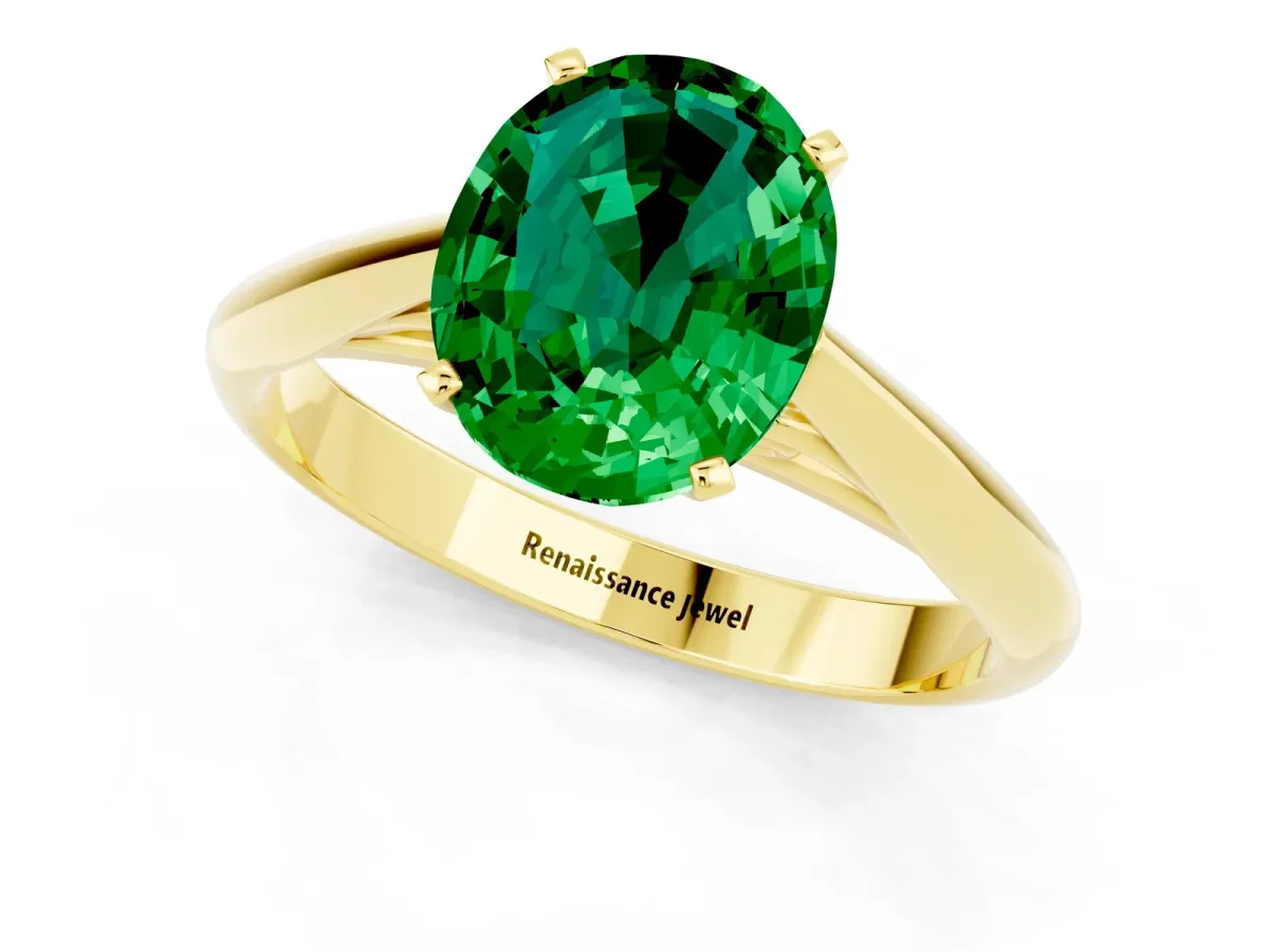 Oval Cut Emerald Solitaire Engagement Ring with Cathedral Setting and Four-Prong Mount Yellow gold