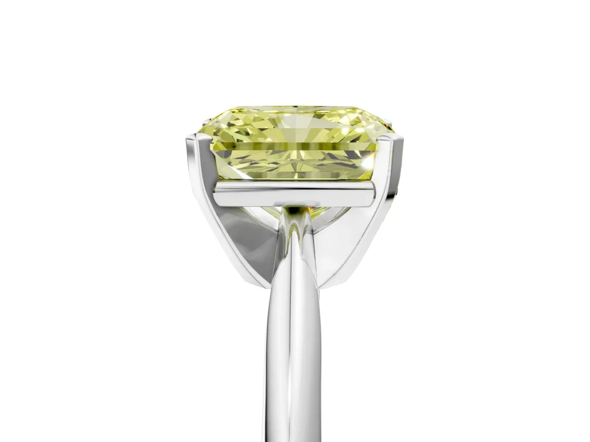 Fancy Yellow Radiant Cut Cut Solitaire Ring with Four-Prong Setting on a Classic Band Platinum