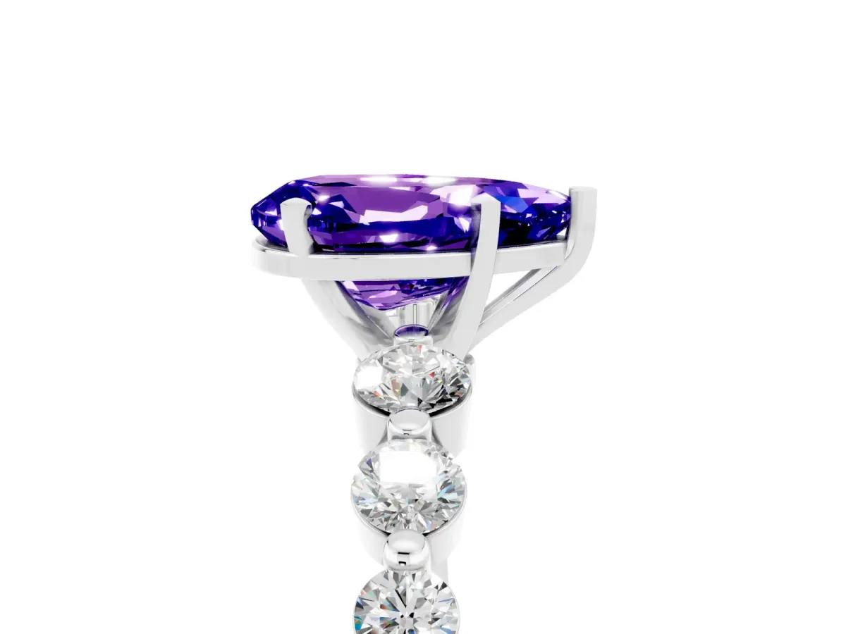 Pear Cut Solitaire Tanzanite Ring with Pave Band and Four-Prong Setting Platinum