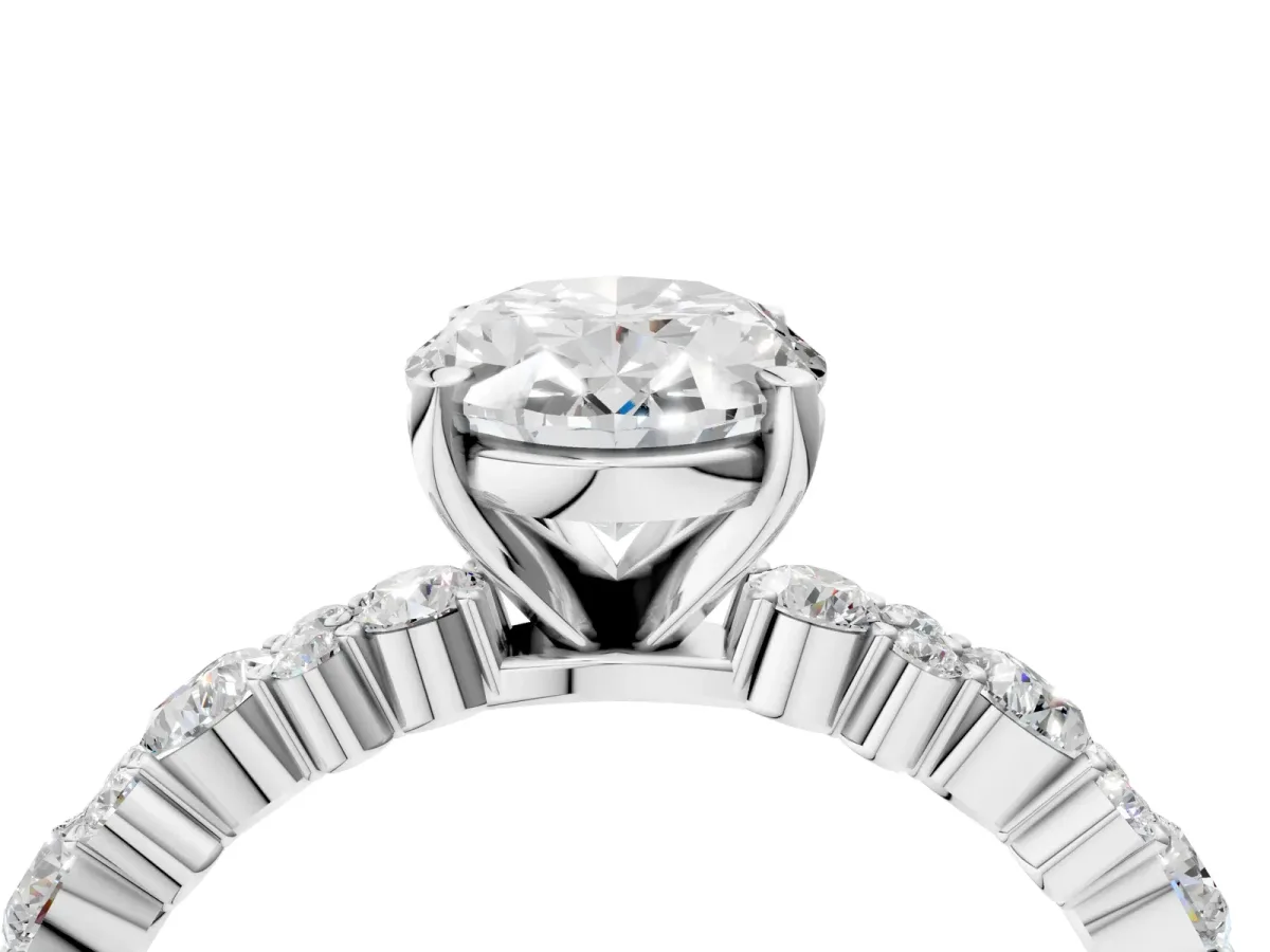 Oval Cut Diamond Side Stone Solitaire Ring with Round Moissanite and Four-Prong Setting Silver