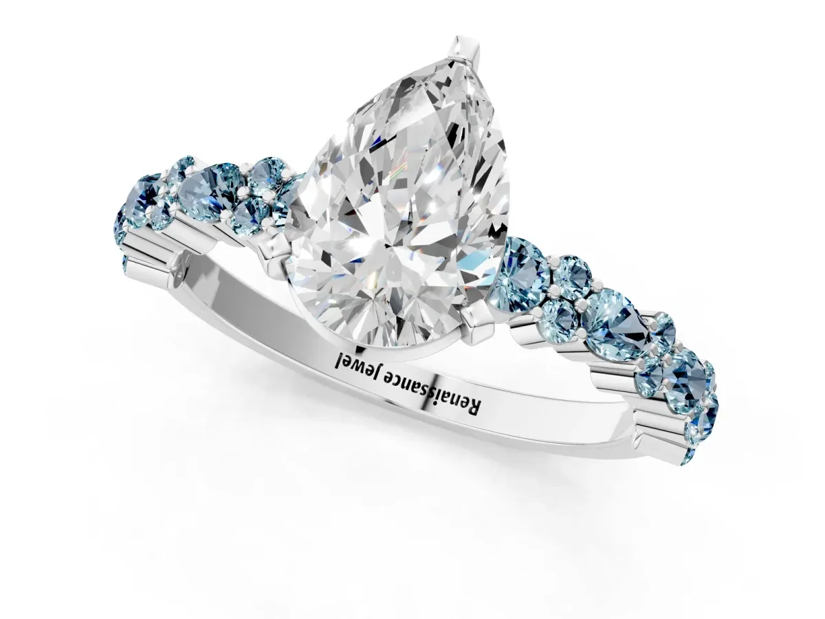 Pear Cut Diamond Side Stone Solitaire Ring with Round Aquamarine and Four-Prong Setting Silver