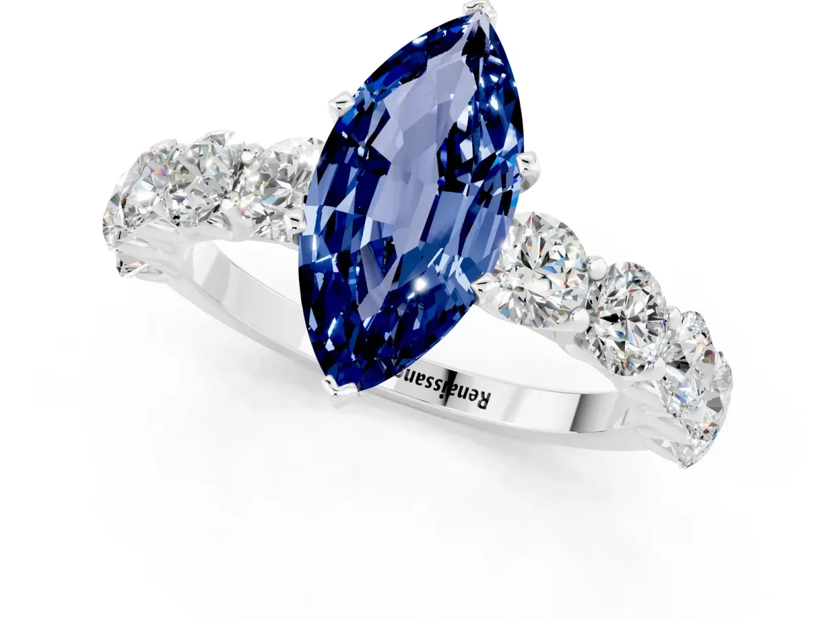 Marquise Cut Blue Sapphire Prong Setting with Side Stones on a Pave Band Silver