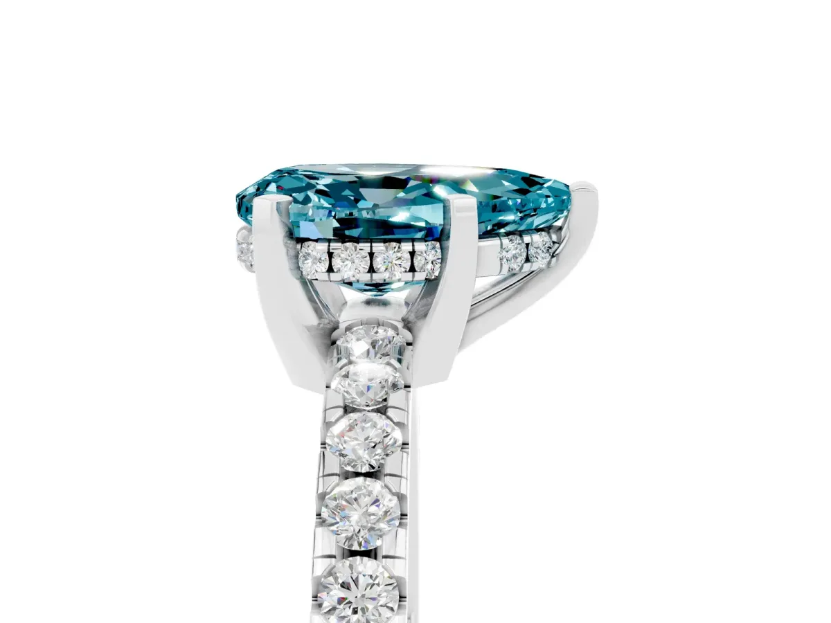 Pear Cut Blue Topaz Solitaire Ring with Round Pavé Band and Four-Prong Setting Silver