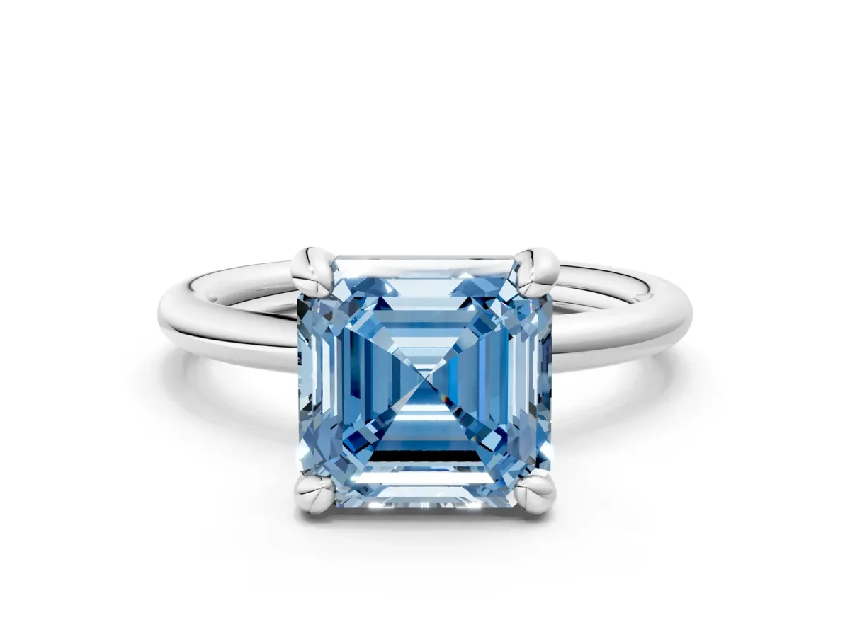 Fancy Blue Asscher Cut Solitaire Diamond Ring with Four-Prong Setting on a Plain Band Platinum