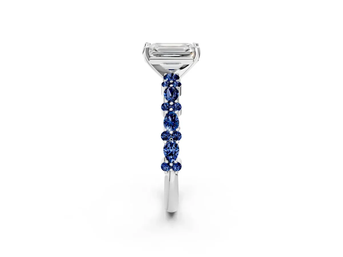 Emerald Cut Diamond Side Stone Solitaire Ring with Round Blue Sapphire and Four-Prong Setting Silver