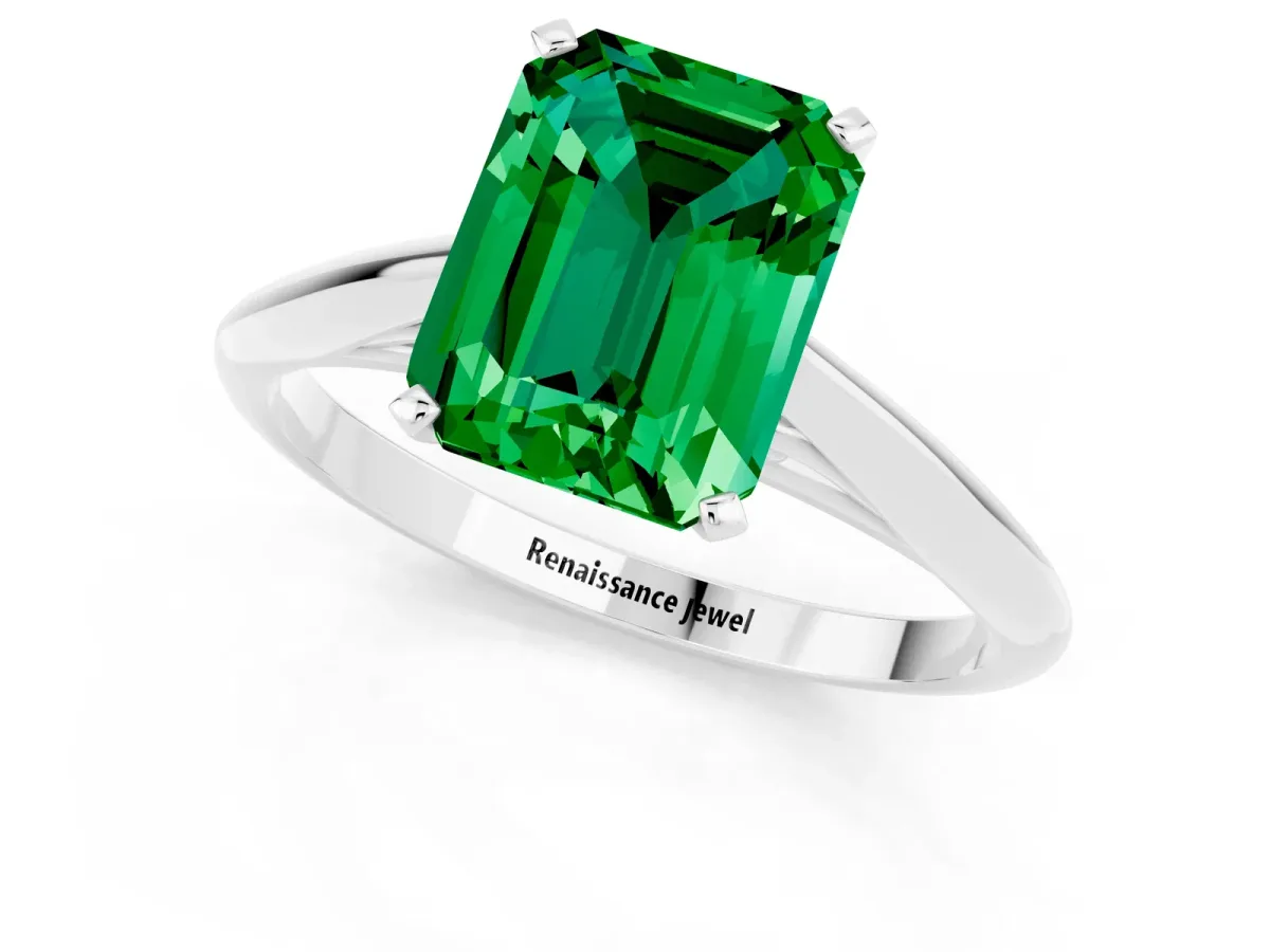Emerald Cut Emerald Solitaire Engagement Ring with Cathedral Setting and Four-Prong Mount White gold