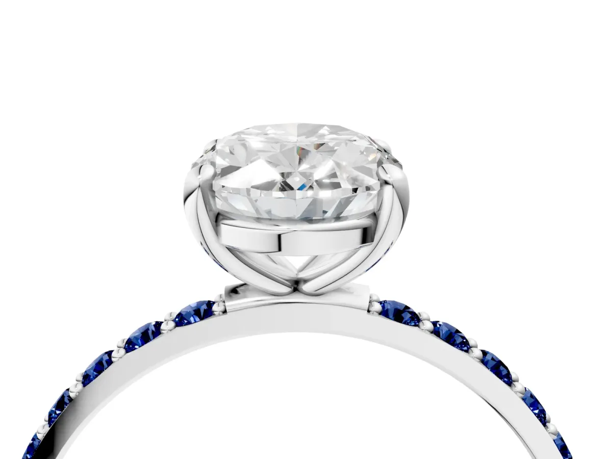 Oval Cut Diamond Solitaire Ring with Round Blue Sapphire Pavé Band and Prong Setting Silver