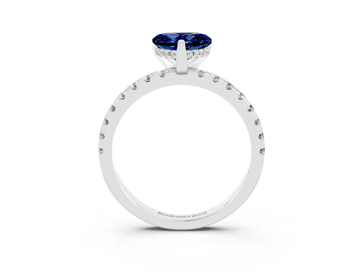 Heart Cut Blue Sapphire Solitaire Ring with Round Pavé Band and Four-Prong Setting Silver