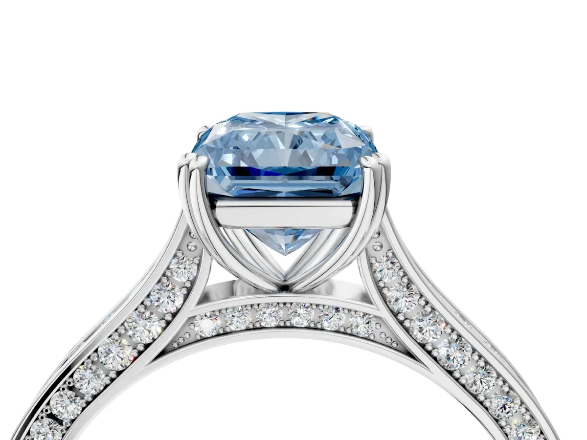 Fancy Blue Radiant Cut Diamond Solitaire with Pave Band and Six-Prong Setting Platinum