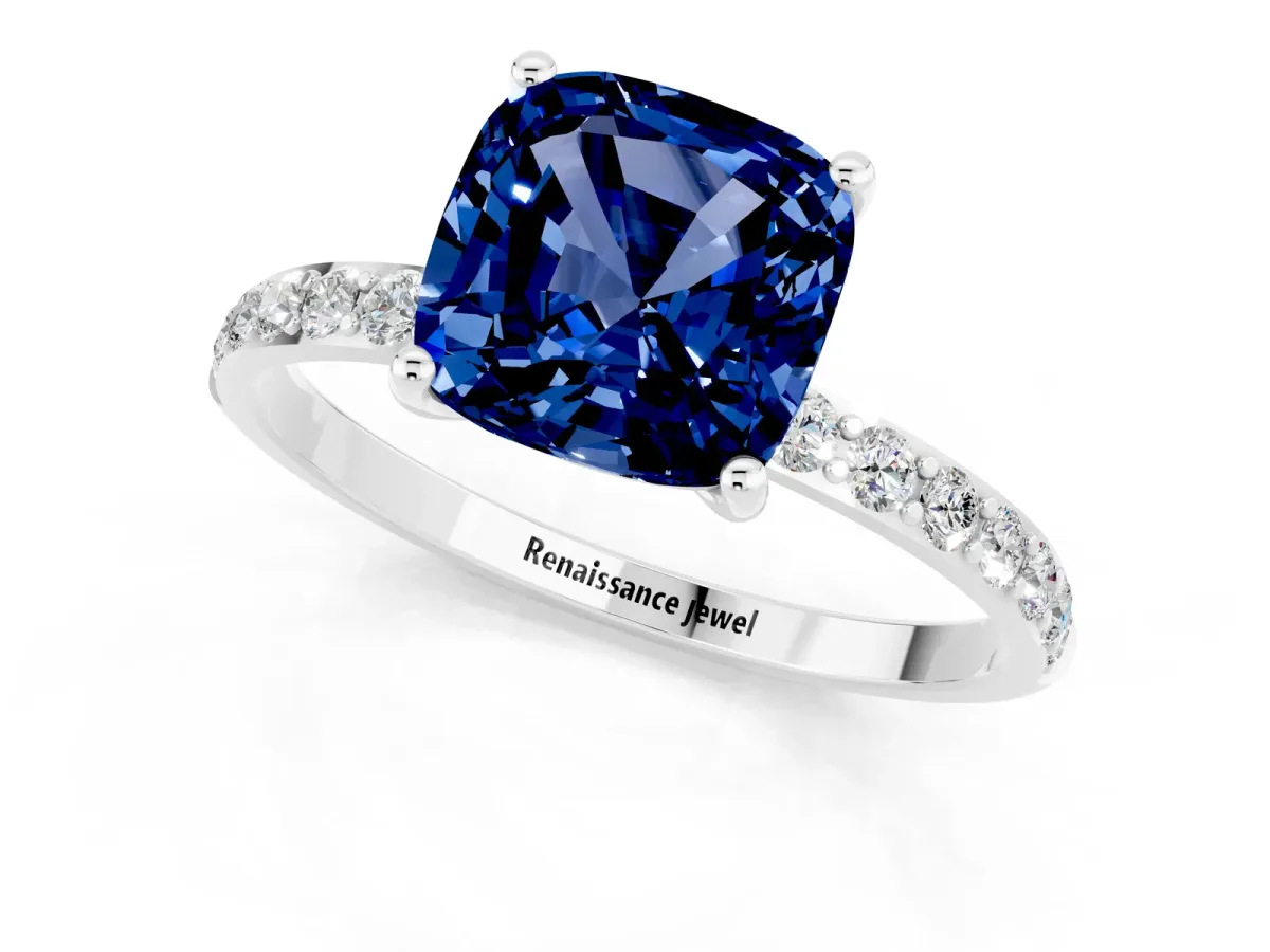 Cushion Cut Blue Sapphire Solitaire Ring with Round Pavé Band and Prong Setting Silver