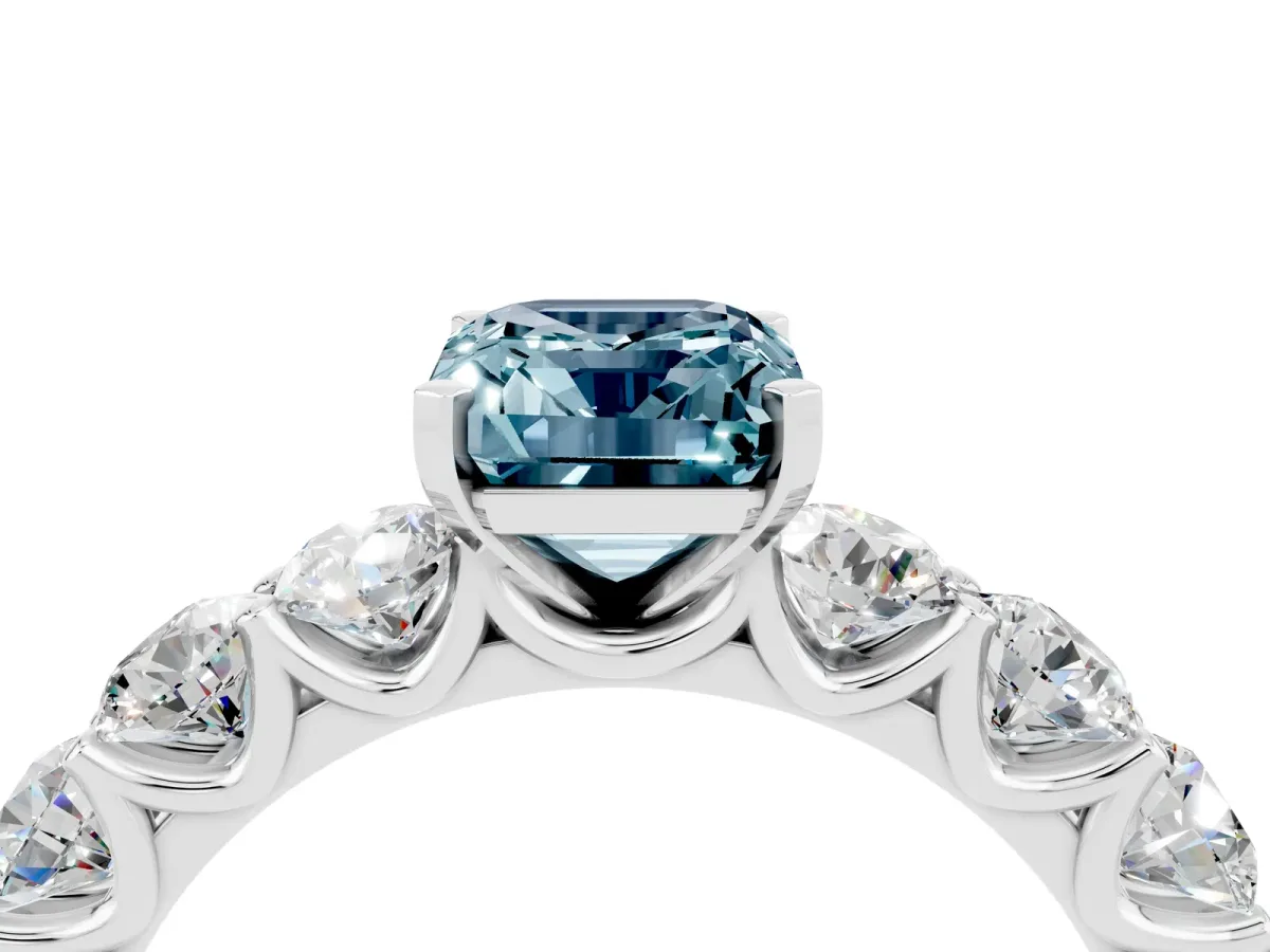 Emerald Cut Aquamarine Prong Setting with Side Stones on a Pave Band Silver