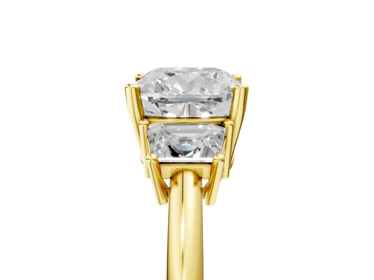 Cushion Cut Diamond Three-Stone Ring with Trapezoid Side Stones and Prong Setting Yellow gold