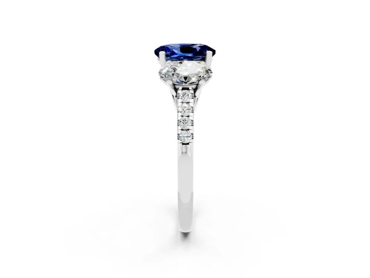 Three-Stone Oval Cut Blue Sapphire Ring with Round Pavé Band and Prong Setting Platinum