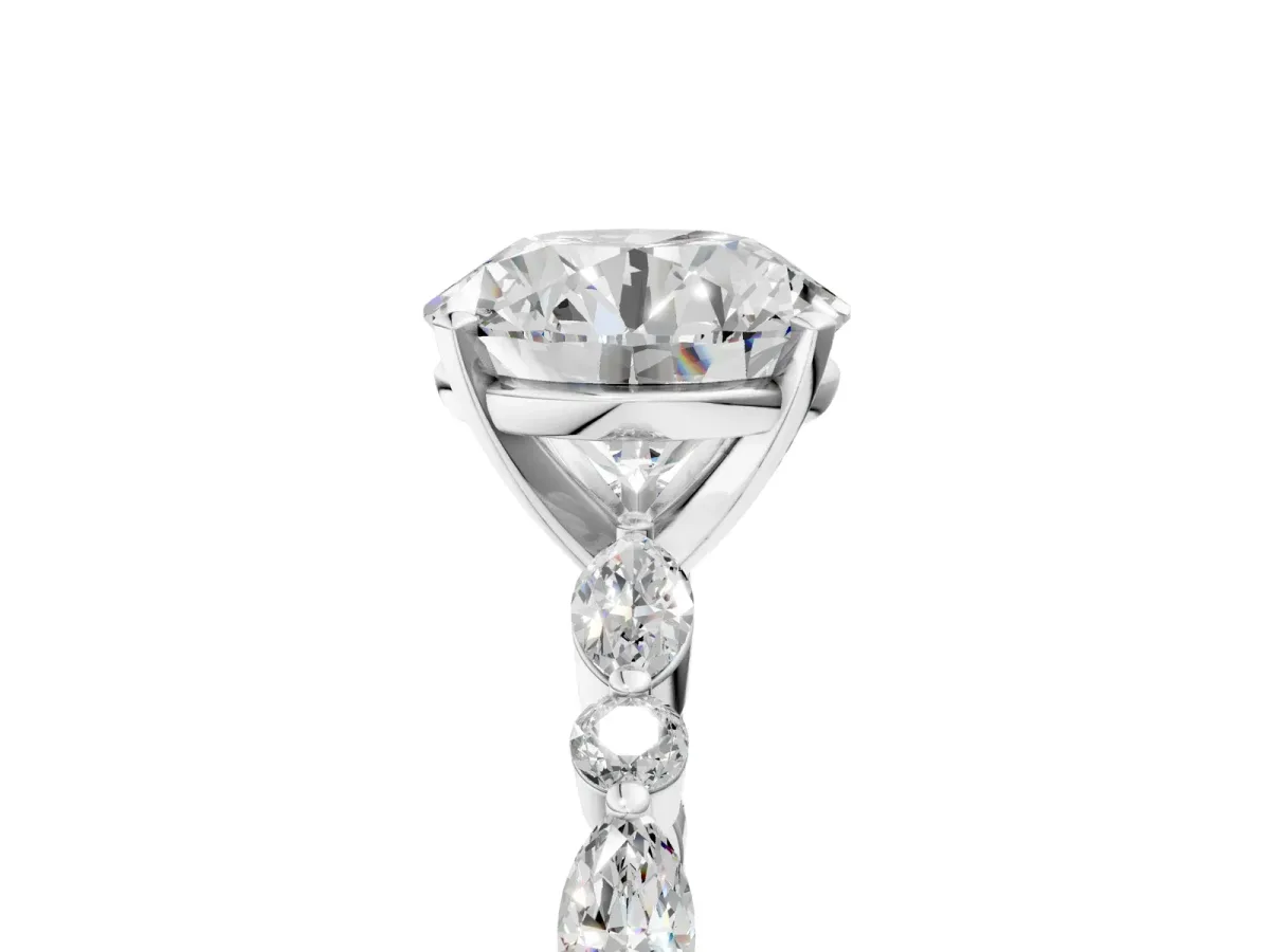Round Cut Diamond Ring with Marquise and Round Side Stones and Four-Prong Setting Silver