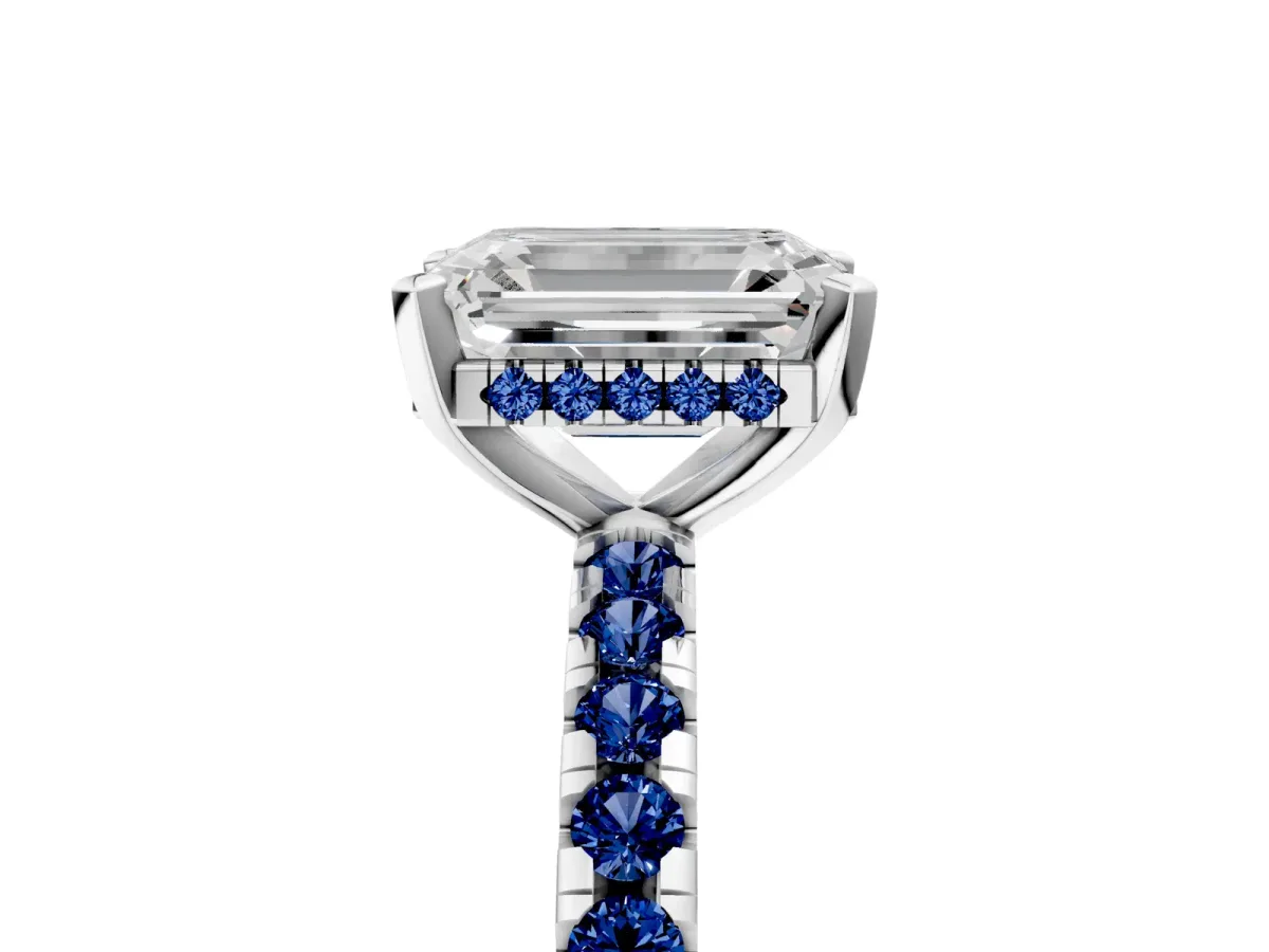 Emerald Cut Diamond Solitaire Ring with Round Blue Sapphire Pavé Band and Four-Prong Setting Silver