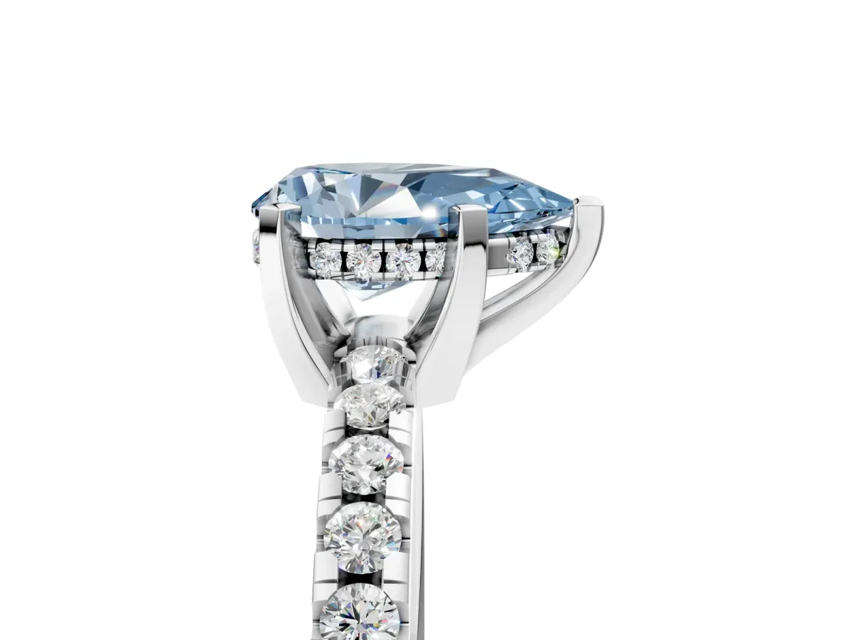 Fancy Blue Pear Cut Diamond Solitaire Ring with Round Pavé Band and Four-Prong Setting Silver