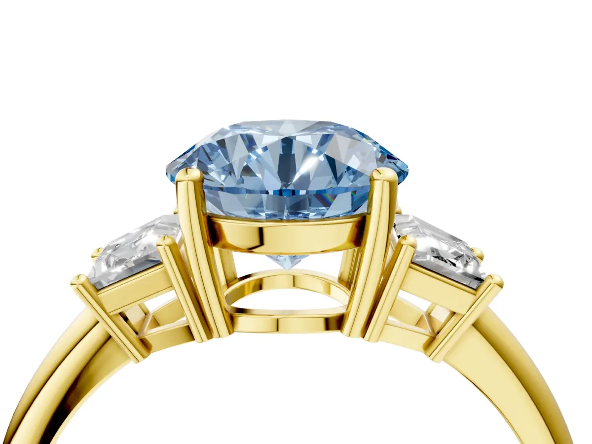 Fancy Blue Round Cut Diamond Three-Stone Ring with Trapezoid Side Stones and Prong Setting Yellow gold