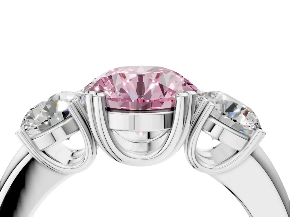Fancy Pink Three-Stone Round Cut Cut Diamond Ring with Channel Set Band and Four-Prong Setting Silver