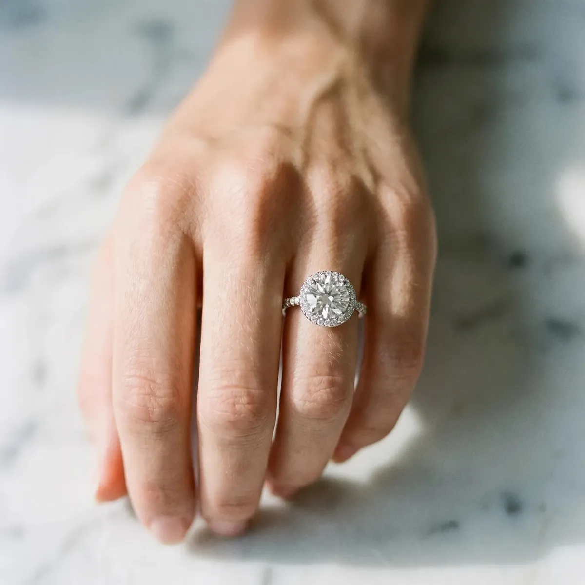 Round Cut Diamond Pavé Halo Ring with Four-Prong Setting White gold