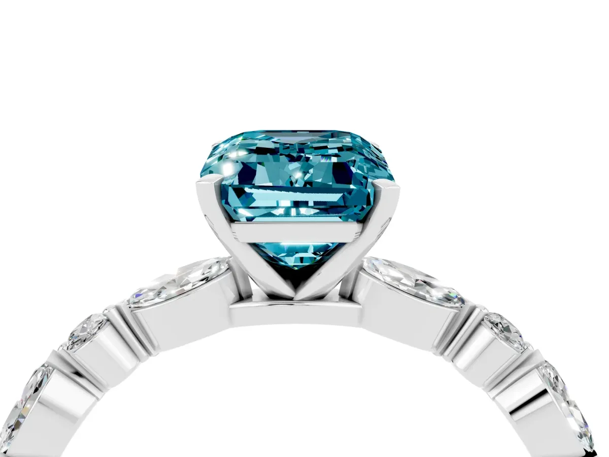 Emerald Cut Blue Topaz Ring with Marquise and Round Side Stones and Four-Prong Setting Silver