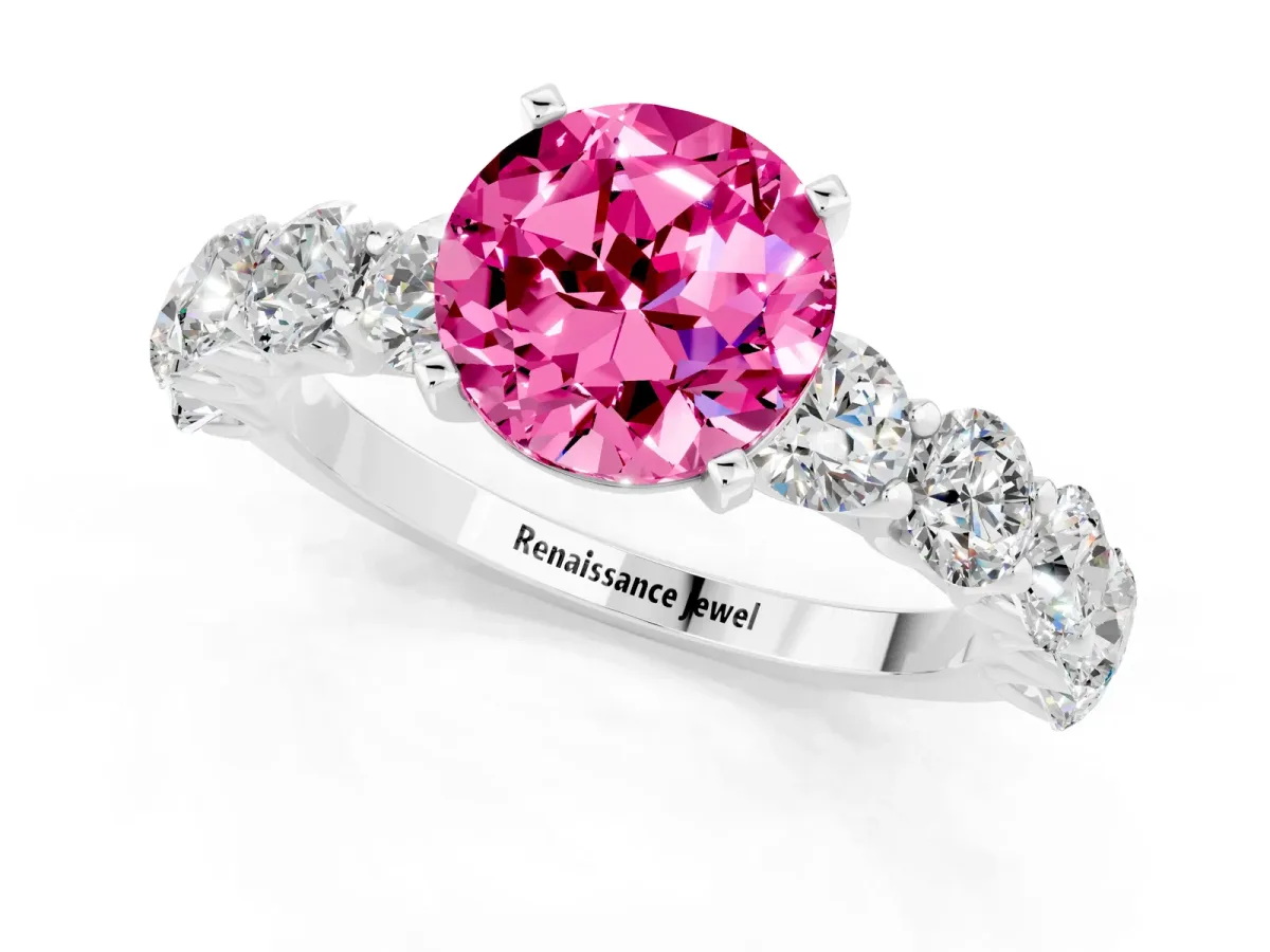 Round Cut Pink Sapphire Prong Setting with Side Stones on a Pave Band Silver