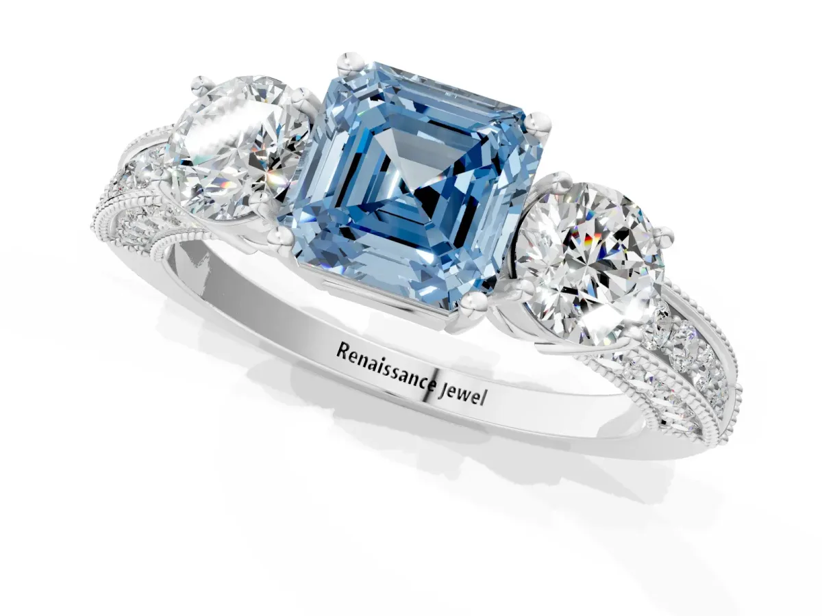Fancy Blue Asscher Cut Three-Stone Diamond Ring with Pavé Band and Four-Prong Setting Platinum