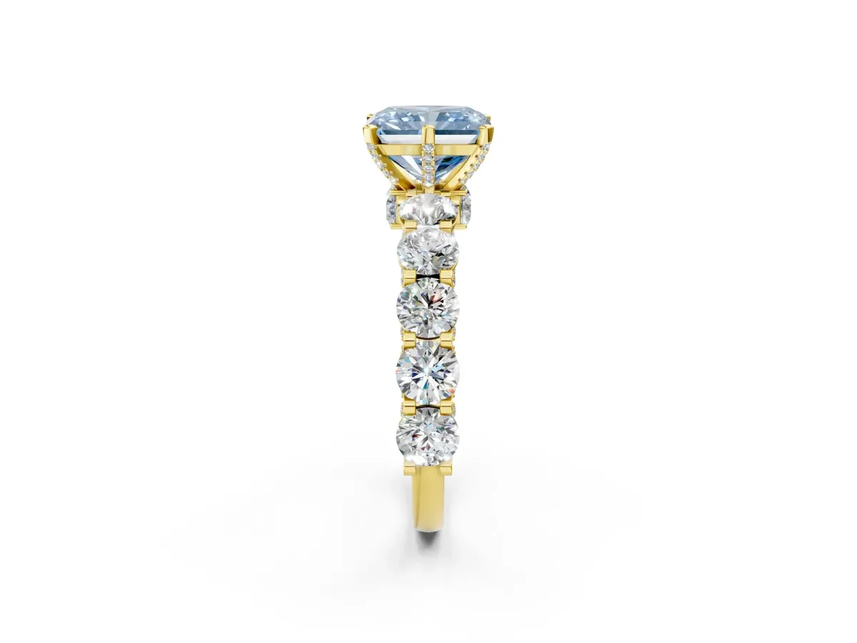 Fancy Blue Radiant Cut Diamond Side Stone Engagement Ring with Four-Prong Setting Yellow gold