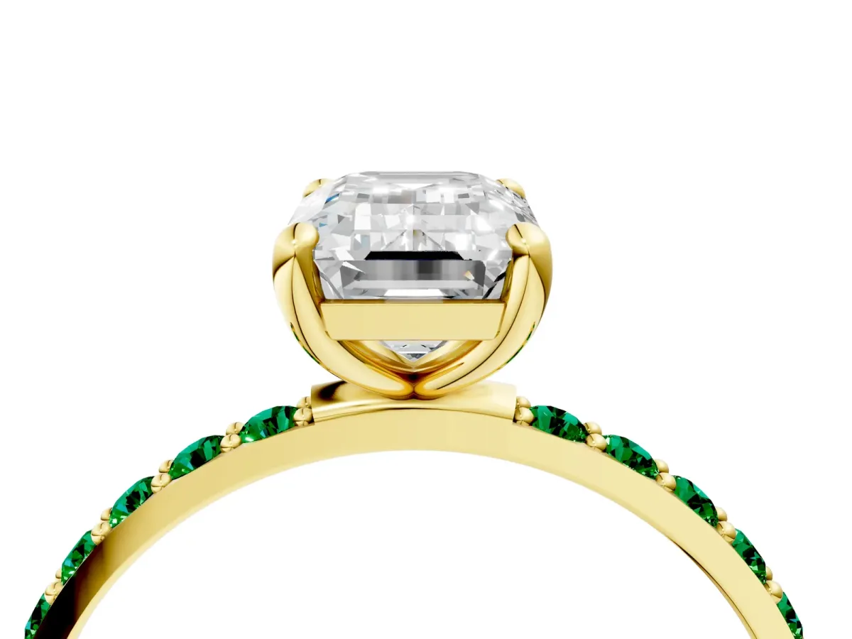 Emerald Cut Diamond Solitaire Ring with Round Emerald Pavé Band and Prong Setting Yellow gold