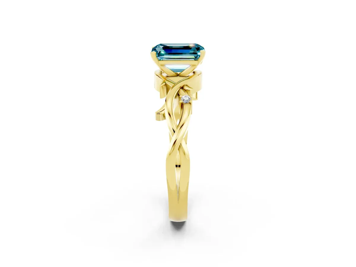 Emerald Cut Blue Topaz Solitaire Ring with Twisted Band and Prong Setting Yellow gold