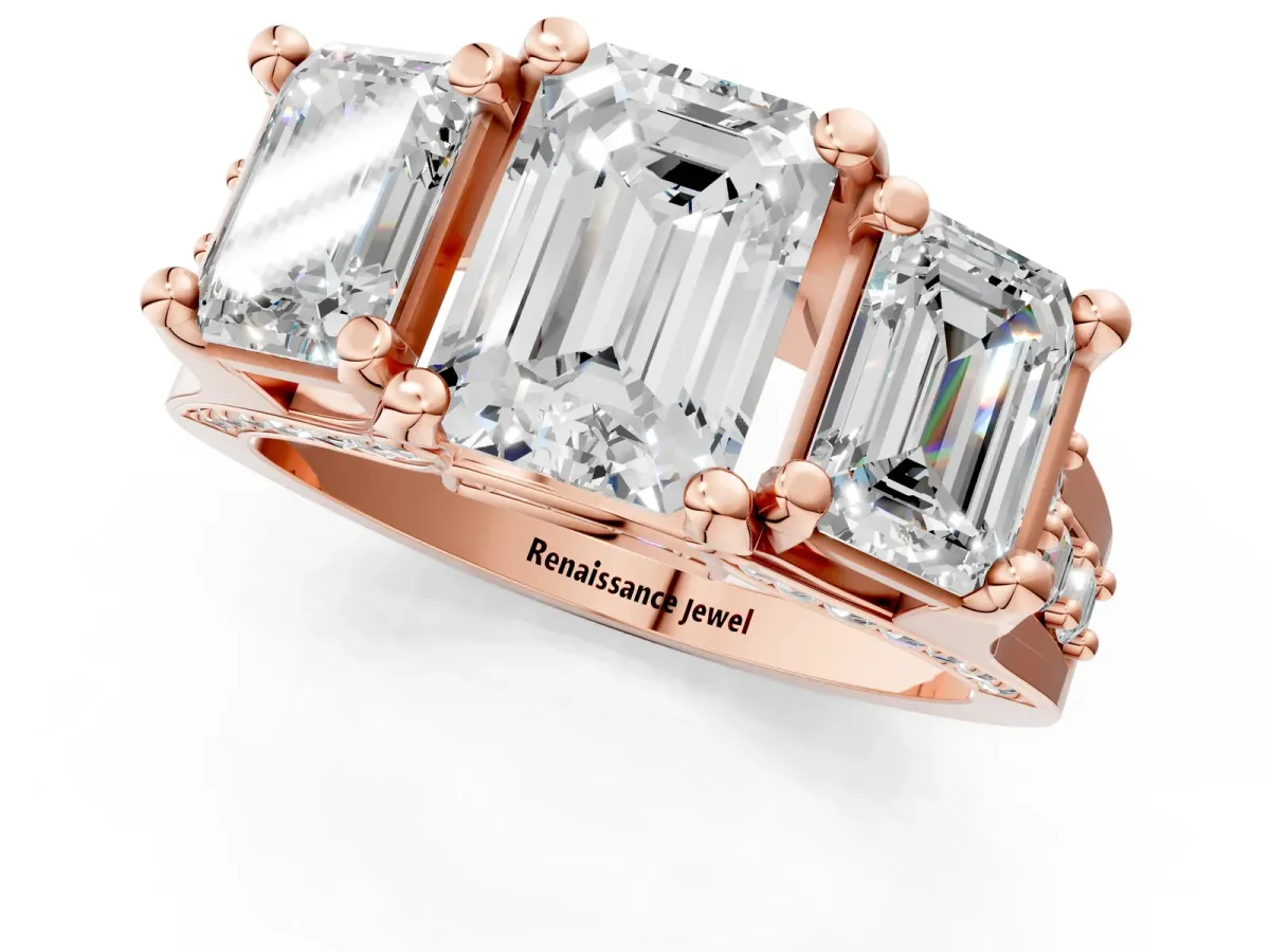 Emerald Cut Diamond Three-Stone Ring with Channel Set Band and Four-Prong Setting Rose gold