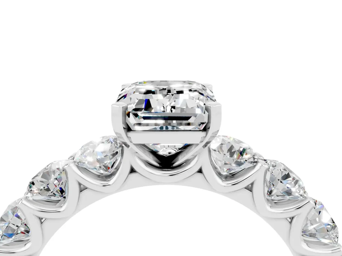 Emerald Cut Moissanite Prong Setting with Side Stones on a Pave Band Silver