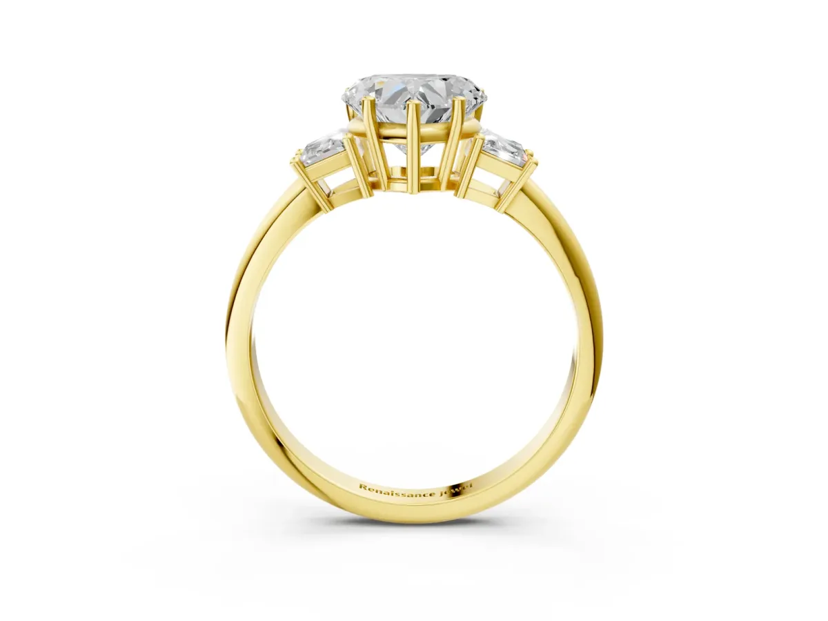 Heart Cut Diamond Three-Stone Ring with Trapezoid Side Stones and Prong Setting Yellow gold