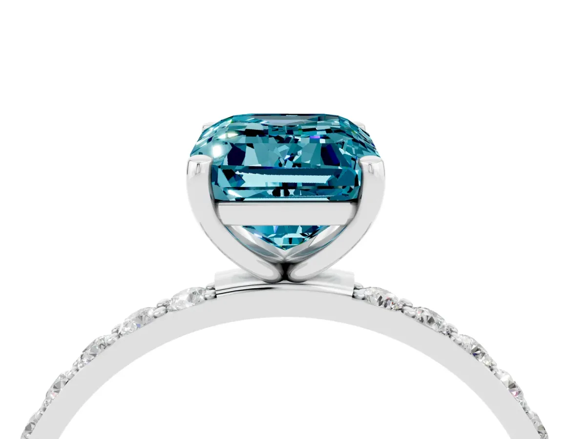 Emerald Cut Blue Topaz Solitaire Ring with Round Pavé Band and Prong Setting Platinum