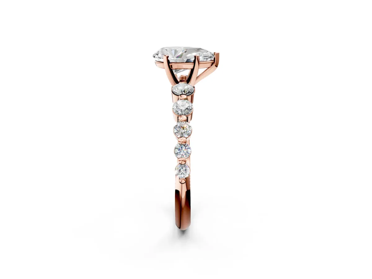 Pear Cut Solitaire Diamond Ring with Pave Band and Four-Prong Setting Rose gold