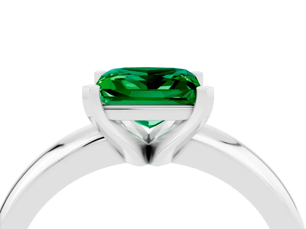 Princess Cut Emerald Solitaire Engagement Ring with Round Band and Four-Prong Setting Silver