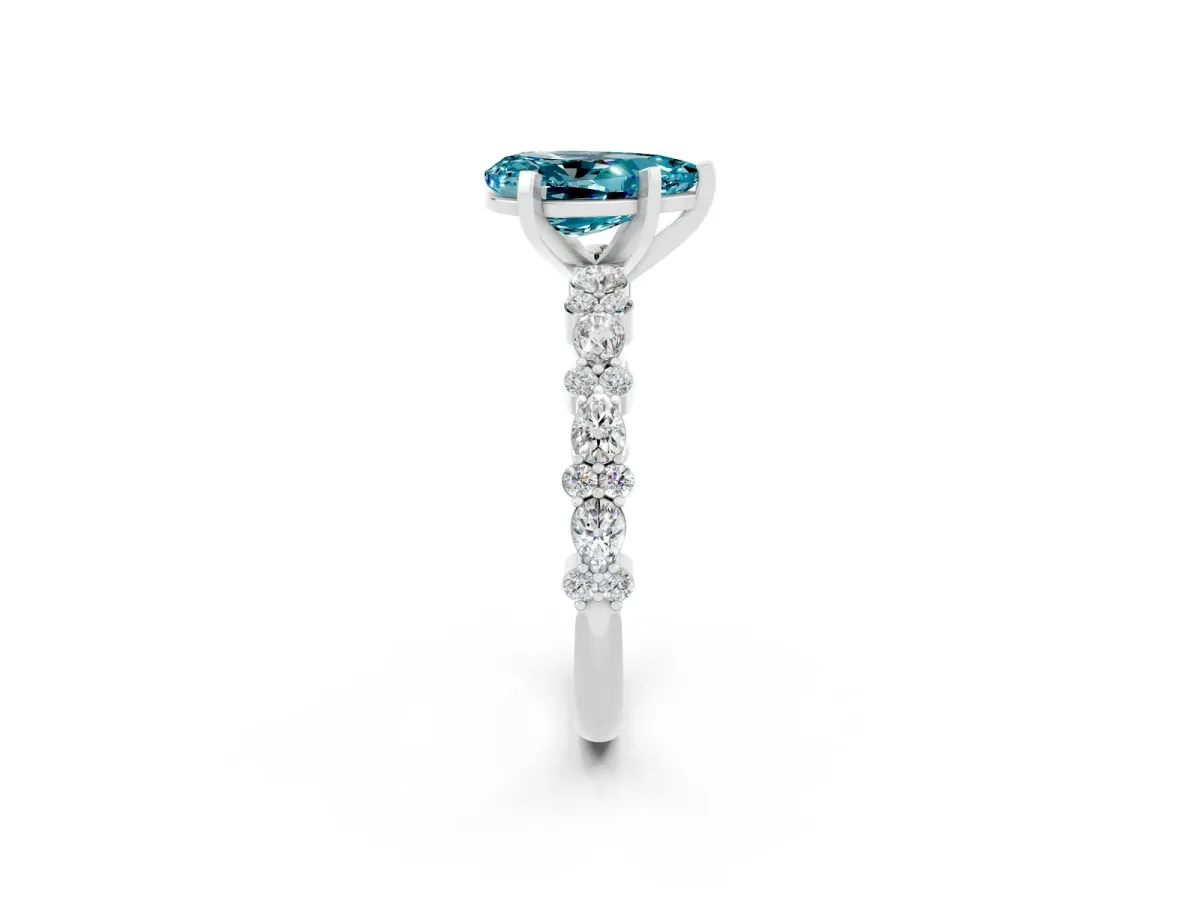 Pear Cut Blue Topaz Side Stone Solitaire Ring with Round and Four-Prong Setting White gold